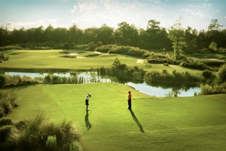 People teeing off at Cape Fear National