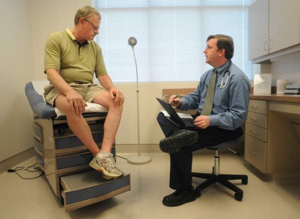 Patient listens to doctor at the New Hanover Regional Medical Center