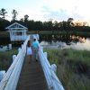 Couple walking to gazebo over a pond