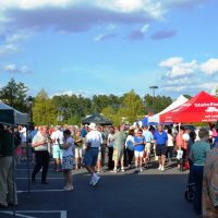 Wide shot of many people enjoying the Villages Block Party