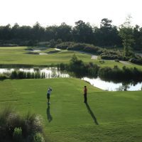 Two Golfers teeing off at Cape Fear National