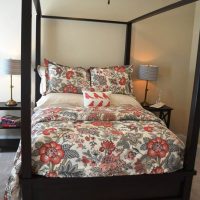 A guest bedroom of the St. Thomas at Brunswick Forest