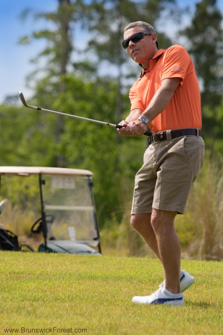 Man chipping at Cape Fear National