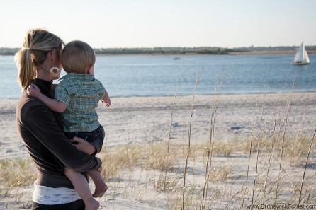 A women and child at the beach at Holden Beach near Brunswick Forest