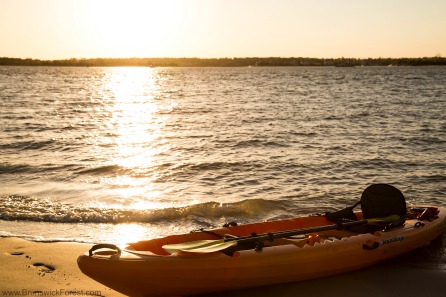 kayak on beach during sunrise