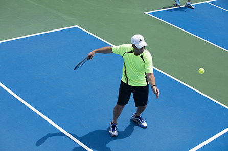 Man serving in Pickleball