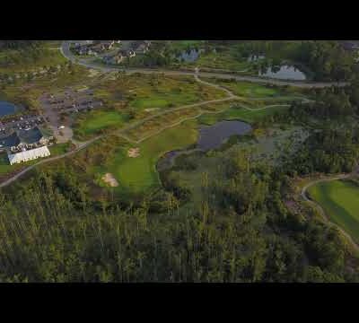 9th Hole, Clubhouse and Practice Greens at Sunset
